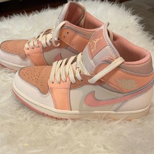 Jordan 1 mid atomic orange sneaker.